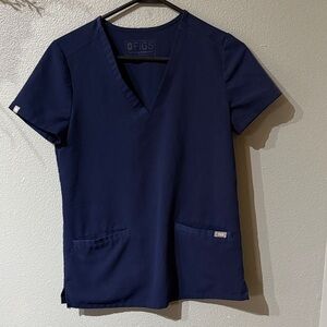 FIGS women’s scrub top. Navy. Size XXS. Front pocket style. Excellent condition